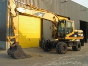 Колесный экскаватор CATERPILLAR M318