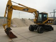 Колесный экскаватор  Caterpillar M318